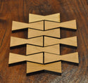 A collection of medium Cherry wood bowtie inlays