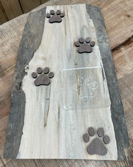 Walnut wood inlay dog prints made with Slab Stitcher's Dog Print Inlay Expansion Pack.