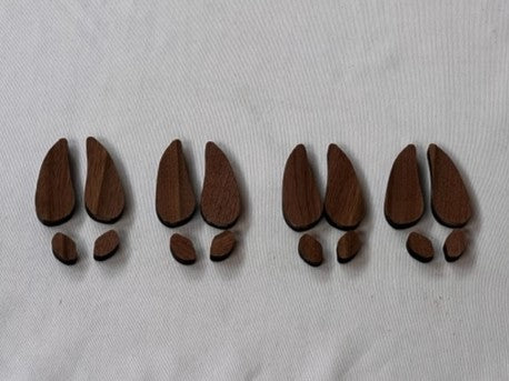 Four pack of 1/4" walnut wood deer track inlays | Slab Stitcher